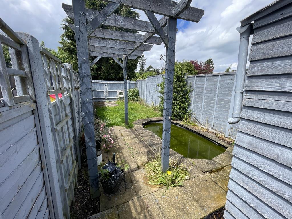 Lot: 162 - MID-TERRACE HOUSE IN NEED OF REFURBISHMENT - outside image of rear portion of rear garden with pond